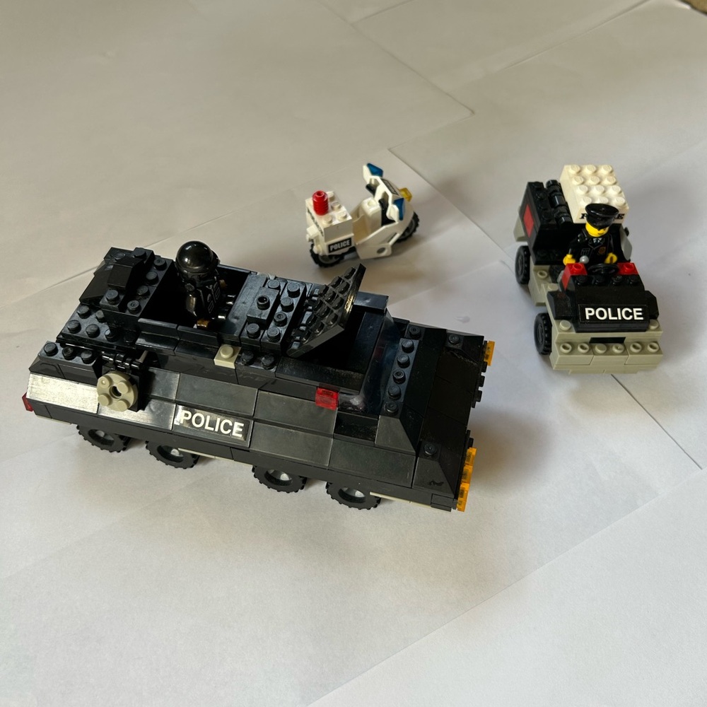 Vintage LEGO Police Vehicles plus two mini figures